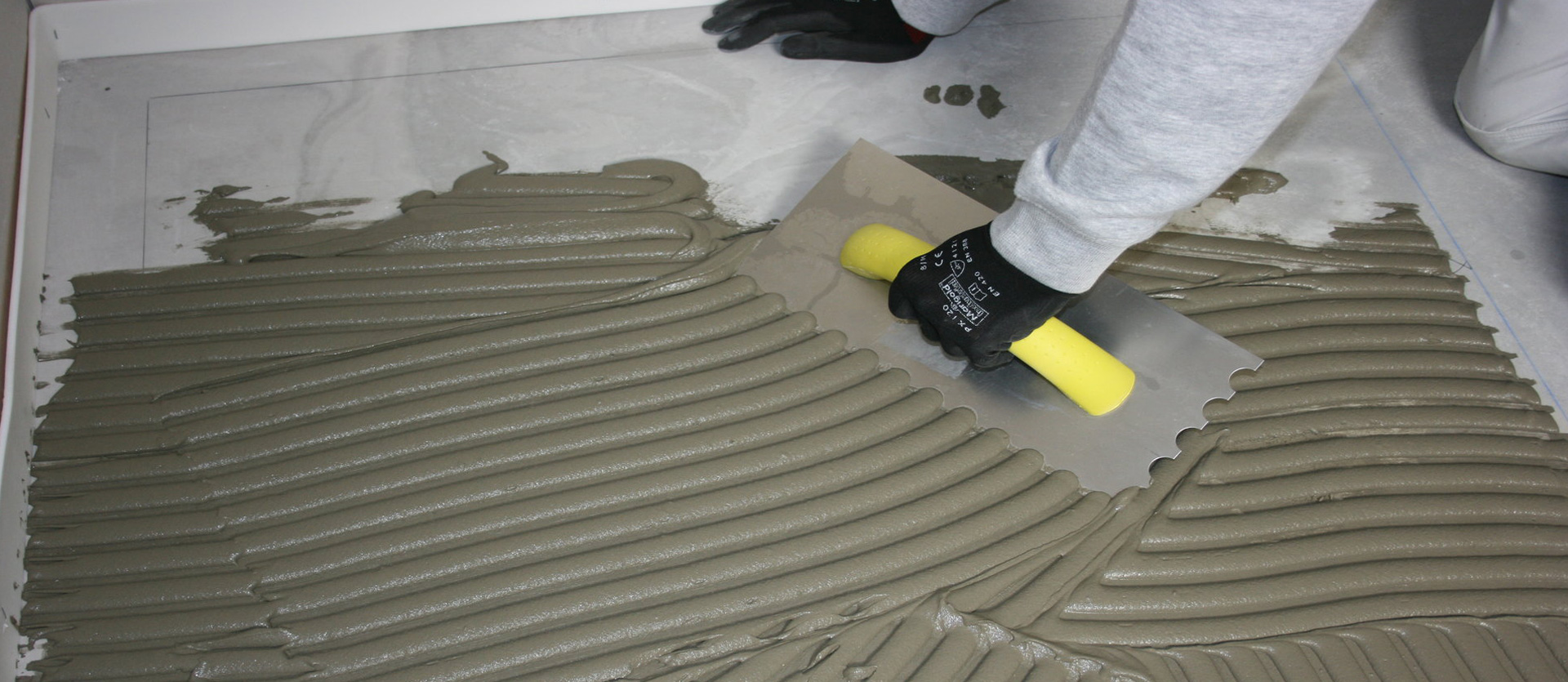 Tiling with adhesive paste